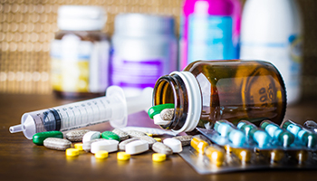 Assorted-medication-bottles-and-pills.jpg