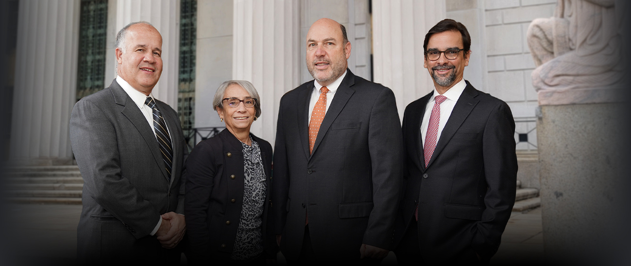 Group photo of Clark, Gagliardi & Miller, P.C. standing in front of a building.